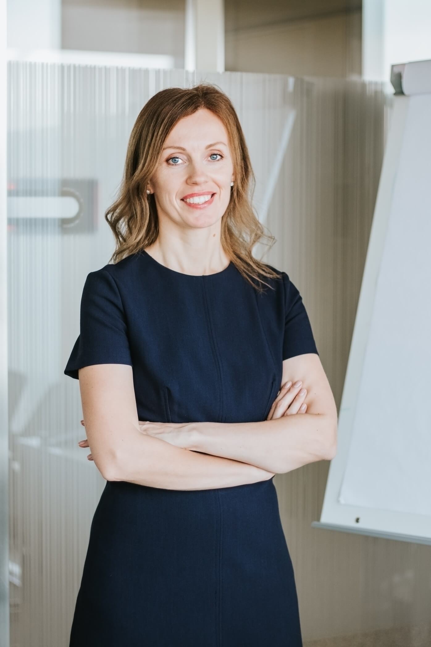 portrait-of-young-attractive-modern-business-woman-in-dark-blue-dress-at-office-looking-at-camera_t20_VL3BVl.jpg