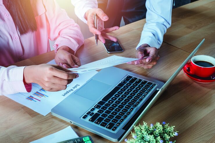 business team analyzing income charts graphs with modern laptop computer 35681 182