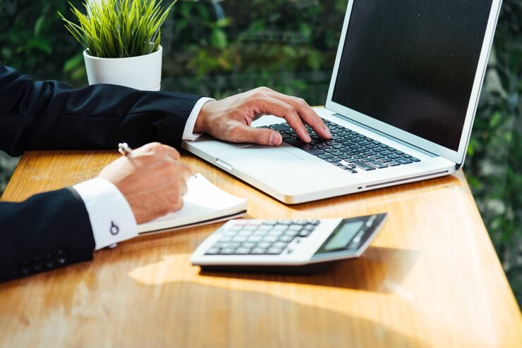 midsection man using laptop table 1048944 9409283