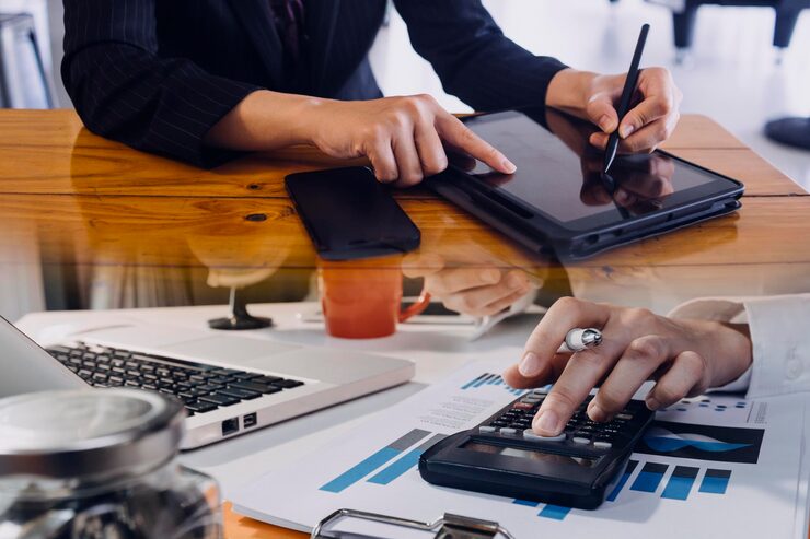 businessman team analyzing financial statement finance task with smart phone laptop tablet wealth management concept 265022 8157