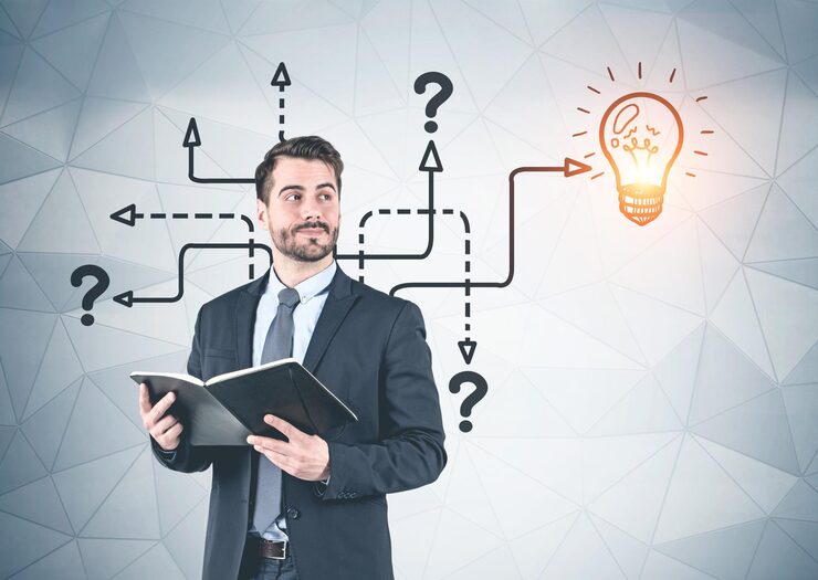 portrait smiling pensive young businessman holding planner looking sideways geometric pattern wall background with question marks light bulb concept business idea 780608 23800