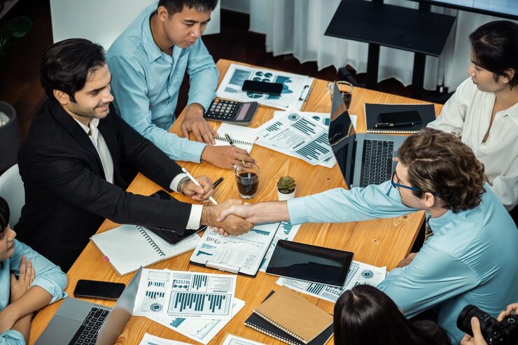 two businessman shake hand meeting room with cheerful colleagues meticulous 31965 671264